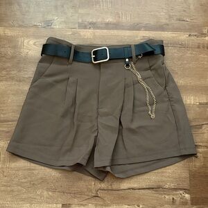 Brown High-Waist Pleated Shorts with Black Belt & Gold Chain Accent